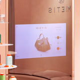Handbag design layout featuring premium hardware options and colorful leather samples at the Mietis Barcelona studio.