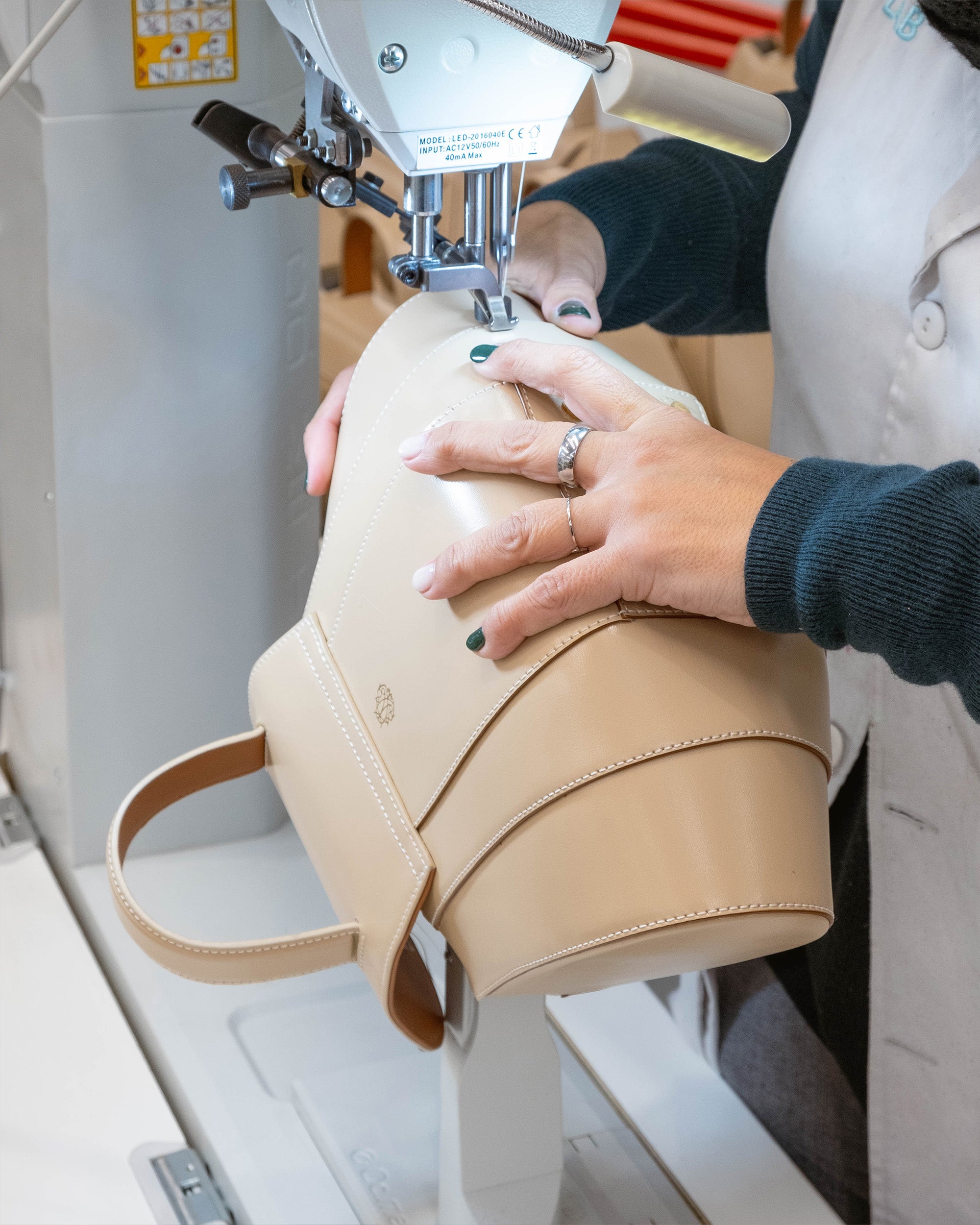 The iconic Mietis Tatito handbag in a unique geometric shape being customized during a studio appointment.