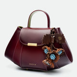 Tatito Cherry Lacquer Fumée leather bag – MIETIS ROOTED Fall.Winter 2026 – 01